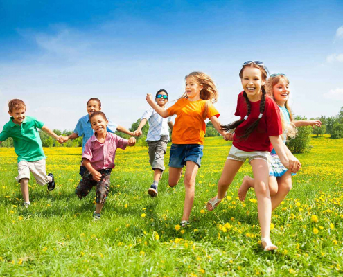 Happy kids running in nature